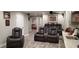 Finished basement with home theater seating, wet bar, recessed lighting, and plank flooring at 1030 Lake Haynes Ne Dr, Conyers, GA 30012