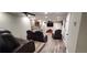 Finished basement with home theater seating, wet bar, recessed lighting, and plank flooring at 1030 Lake Haynes Ne Dr, Conyers, GA 30012