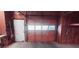View of unfinished basement with a garage door and an entry door to the home at 1030 Lake Haynes Ne Dr, Conyers, GA 30012