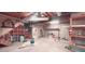 Spacious unfinished basement showing storage under stairs and open doorway to upstairs at 1030 Lake Haynes Ne Dr, Conyers, GA 30012