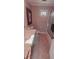 Bathroom with a single sink vanity, framed mirror, and shower at 1030 Lake Haynes Ne Dr, Conyers, GA 30012