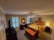 Comfortable bedroom with patterned bedding, shuttered windows, and classic furnishings at 1030 Lake Haynes Ne Dr, Conyers, GA 30012