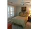 Comfortable bedroom with a ceiling fan and window with shutters at 1030 Lake Haynes Ne Dr, Conyers, GA 30012