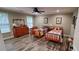 Charming bedroom with two twin beds, a dresser, and natural light from the windows at 1030 Lake Haynes Ne Dr, Conyers, GA 30012