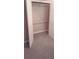 Empty closet with carpeting and rod for hanging clothes at 1030 Lake Haynes Ne Dr, Conyers, GA 30012