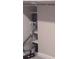 A walk-in closet with shelving has a vacuum cleaner to help keep it clean at 1030 Lake Haynes Ne Dr, Conyers, GA 30012