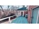 Wide wooden deck with white railing, offering backyard views and outdoor living space at 1030 Lake Haynes Ne Dr, Conyers, GA 30012