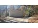 Tan metal two-car detached garage at 1030 Lake Haynes Ne Dr, Conyers, GA 30012