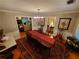 Elegant dining room showcasing hardwood floors and chandelier lighting at 1030 Lake Haynes Ne Dr, Conyers, GA 30012