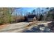 Long driveway leading to a brick house at 1030 Lake Haynes Ne Dr, Conyers, GA 30012