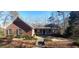 Brick house with gray roof, shutters, and a porch at 1030 Lake Haynes Ne Dr, Conyers, GA 30012