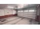 An empty garage with a garage door and storage space at 1030 Lake Haynes Ne Dr, Conyers, GA 30012