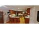 Spacious kitchen featuring wood cabinets, granite counters, and hardwood floors at 1030 Lake Haynes Ne Dr, Conyers, GA 30012