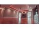Spacious living room with brick fireplace, ceiling fan, and hardwood flooring at 1030 Lake Haynes Ne Dr, Conyers, GA 30012