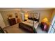 Well-lit main bedroom with a four-poster bed, complementing furniture, and a serene ambiance at 1030 Lake Haynes Ne Dr, Conyers, GA 30012