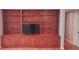 Built-in shelving unit with cabinets and display space for a TV at 1030 Lake Haynes Ne Dr, Conyers, GA 30012