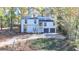 Two-story house, two-car garage, basketball court, and wooded setting at 2490 Woodfern Ct, Marietta, GA 30062