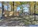 Large backyard with fenced perimeter and mature trees at 2490 Woodfern Ct, Marietta, GA 30062