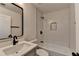 Modern bathroom with white subway tile and black matte fixtures at 2490 Woodfern Ct, Marietta, GA 30062