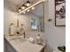Modern bathroom with gold fixtures and quartz countertop at 2490 Woodfern Ct, Marietta, GA 30062