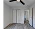 Bedroom with wood-look floors, bifold doors, and access to hallway at 2490 Woodfern Ct, Marietta, GA 30062