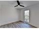 Bright bedroom with wood-look flooring and ceiling fan at 2490 Woodfern Ct, Marietta, GA 30062