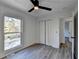 Bedroom with wood-look floors, bifold doors and a window at 2490 Woodfern Ct, Marietta, GA 30062