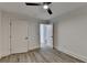 Simple bedroom with ceiling fan and grey vinyl flooring at 2490 Woodfern Ct, Marietta, GA 30062