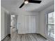 Bedroom with wood-look floors, ceiling fan and hallway access at 2490 Woodfern Ct, Marietta, GA 30062