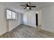 Spacious basement bedroom with ceiling fan and grey vinyl flooring at 2490 Woodfern Ct, Marietta, GA 30062