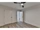 Simple bedroom with ceiling fan and grey vinyl flooring at 2490 Woodfern Ct, Marietta, GA 30062