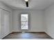 Bedroom with wood-look floors, window, and bifold doors at 2490 Woodfern Ct, Marietta, GA 30062