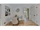 Breakfast nook with glass table and modern chairs, hardwood floors at 2490 Woodfern Ct, Marietta, GA 30062