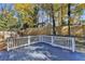 Newly stained deck with white railings, offering backyard access at 2490 Woodfern Ct, Marietta, GA 30062
