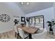 Bright dining room features hardwood floors, a large wooden table, and access to the kitchen at 2490 Woodfern Ct, Marietta, GA 30062
