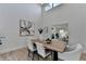 Spacious dining room with hardwood floors, a large wooden table and view into the living room at 2490 Woodfern Ct, Marietta, GA 30062