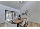 Modern dining room with hardwood floors, a wooden table, and access to a screened porch at 2490 Woodfern Ct, Marietta, GA 30062