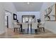 Bright dining room with hardwood floors, large table, and access to a screened porch at 2490 Woodfern Ct, Marietta, GA 30062