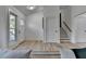 Bright and airy entryway with hardwood floors and view of staircase at 2490 Woodfern Ct, Marietta, GA 30062