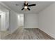 Clean and bright hallway with grey vinyl flooring and access to the stairs at 2490 Woodfern Ct, Marietta, GA 30062