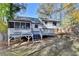 Rear view of house with deck and partially fenced backyard at 2490 Woodfern Ct, Marietta, GA 30062