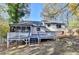 Back of house, showcasing deck and screened porch at 2490 Woodfern Ct, Marietta, GA 30062