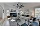 Spacious living room with hardwood floors, fireplace and ceiling fan at 2490 Woodfern Ct, Marietta, GA 30062