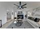 Modern living room with hardwood floors, fireplace, and ceiling fan at 2490 Woodfern Ct, Marietta, GA 30062