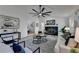 Open concept living room with hardwood floors, fireplace, and ceiling fan at 2490 Woodfern Ct, Marietta, GA 30062