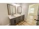 Modern bathroom with double vanity, and updated fixtures at 3819 Landgraf Cv, Decatur, GA 30034