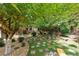 Landscaped backyard with stone pathways and shaded seating areas at 7108 Roselake Cir, Douglasville, GA 30134