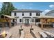 Large backyard with expansive patio, two gazebos, and fire pit at 7108 Roselake Cir, Douglasville, GA 30134