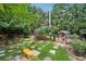 Landscaped backyard with dog run and storage shed at 7108 Roselake Cir, Douglasville, GA 30134