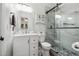 Modern bathroom with white vanity, marble shower, and a toilet at 7108 Roselake Cir, Douglasville, GA 30134